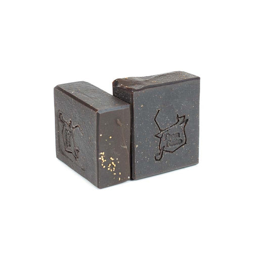 Cardamom and Sweet Cream artisan soap by Jabonera Don Gato from the Bestsellers collection with rich brown tone and subtle golden specks on white background.
